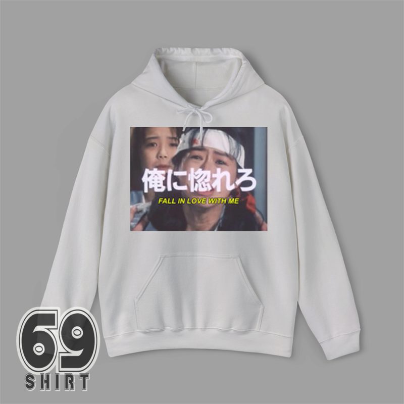 Oversized hoodie with bold 2015 Rihanna 'Fall in Love with Me' print, worn in streetwear outfit with sneakers and joggers.