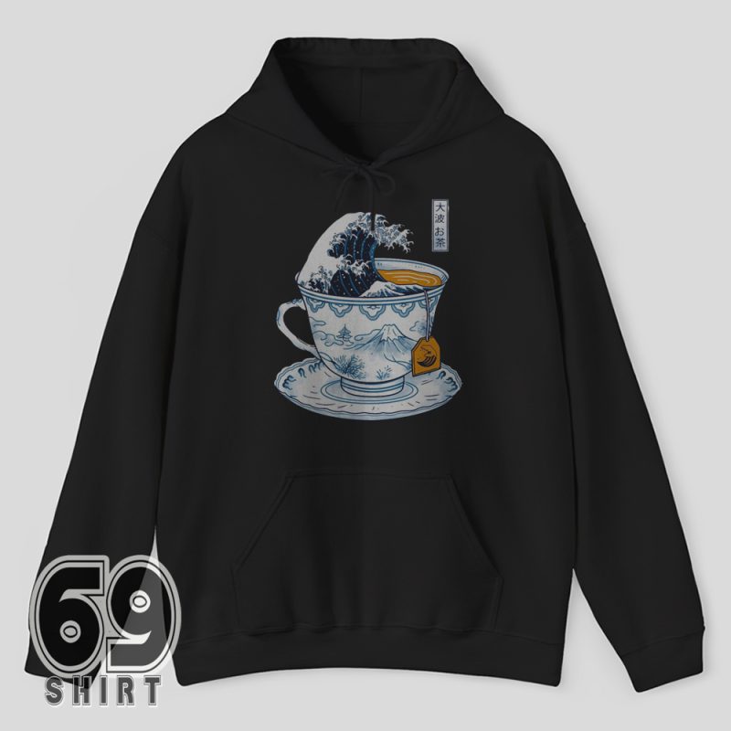 Hoodie graphic of The Great Wave crashing inside a blue tea cup with orange tea and Fuji illustration
