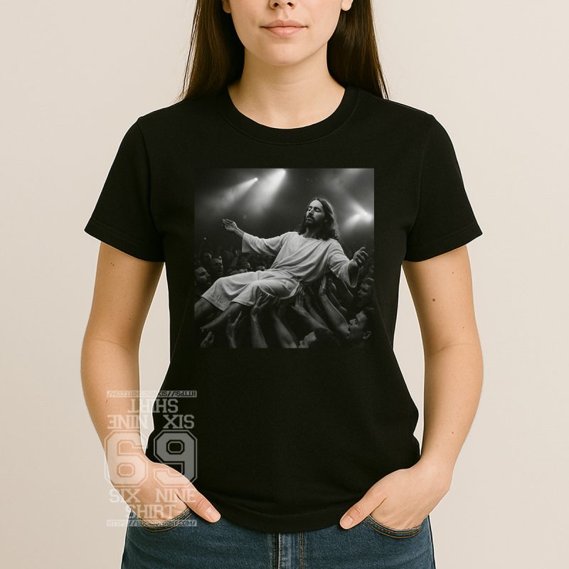 Black and white Women graphic t-shirt of Jesus crowd surfing at a rock concert surrounded by cheering fans