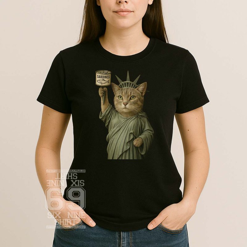 Illustration of a cat dressed as the Statue of Liberty holding a sardine can, printed on a novelty t-shirt