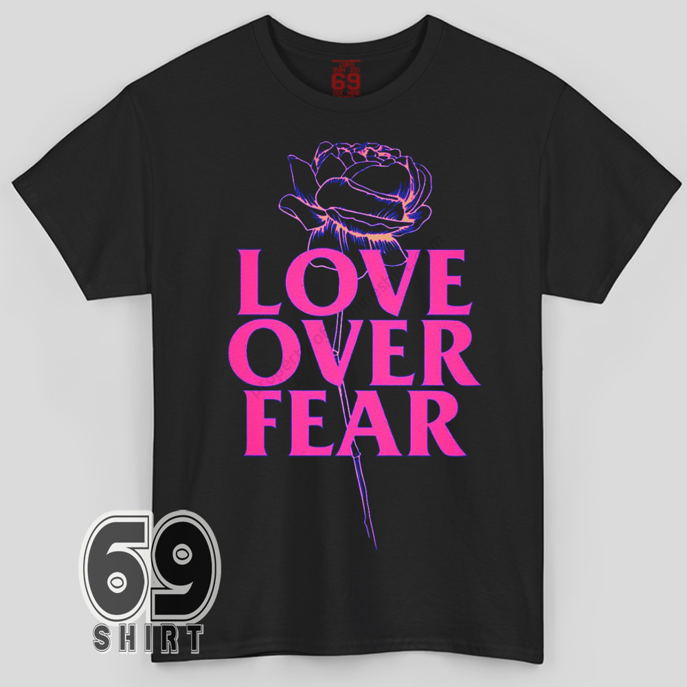 Love Over Fear Rose Graphic T-shirt Love Over Fear graphic t-shirt with neon pink lettering and rose illustration on black background